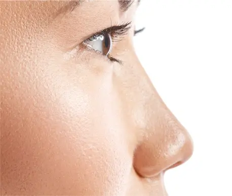 A close-up profile shot of a person's face, focusing on their nose